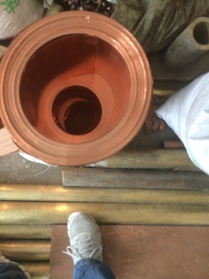 Copper strip wound into a coil in a workshop